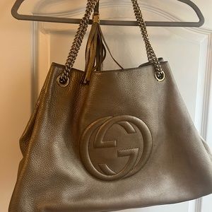 Be owned Gucci Soho taupe color hobo leather large bag with chain.